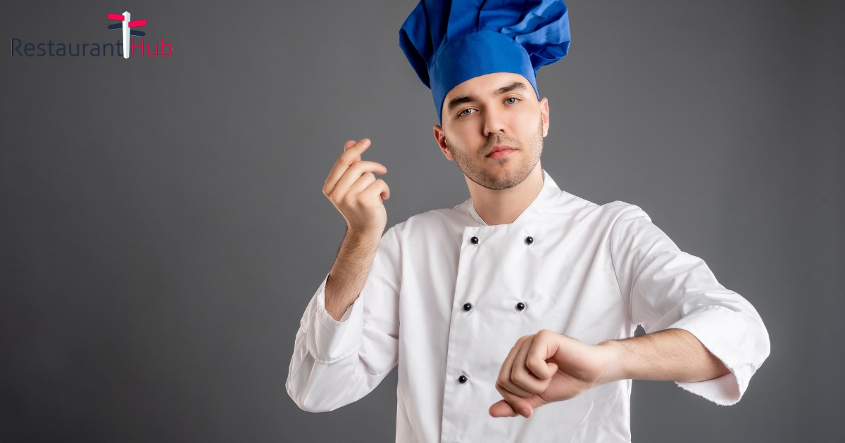 Young male dressed in a white chef suit showing time is money